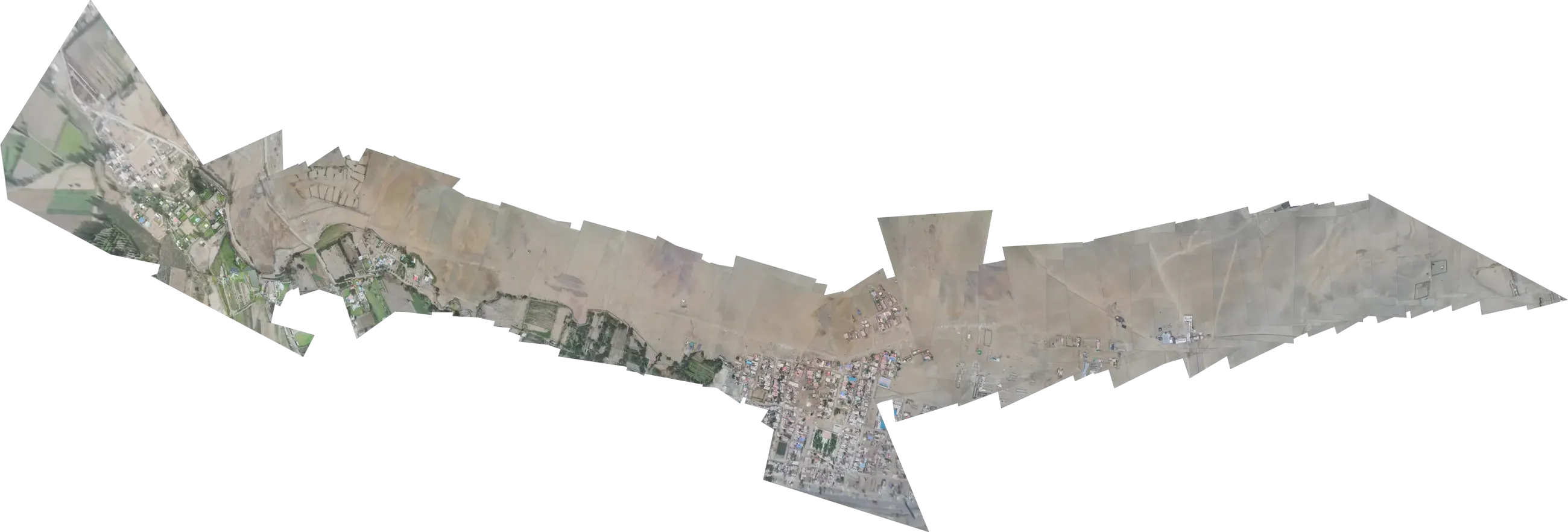 Mosaico de fotos aéreas de un vuelo, unidas sobre el terreno, que aparece desde el negro con la luz